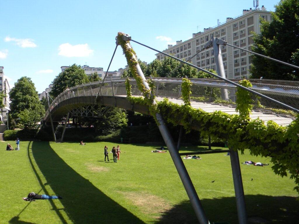 a bridge over a grassy field