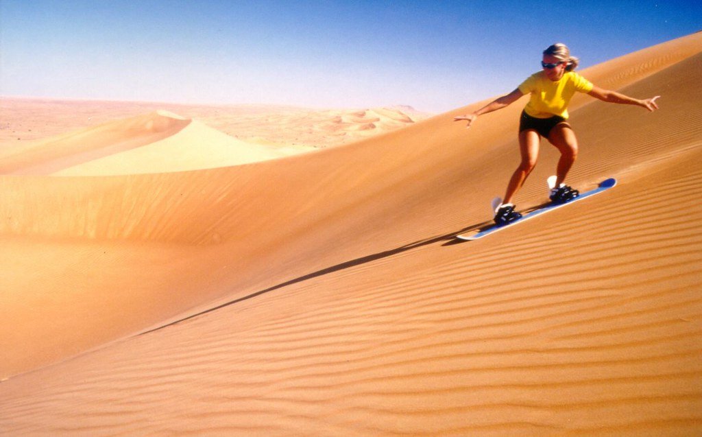 Dubai - Desert dunes colored in shades of orange and purple
