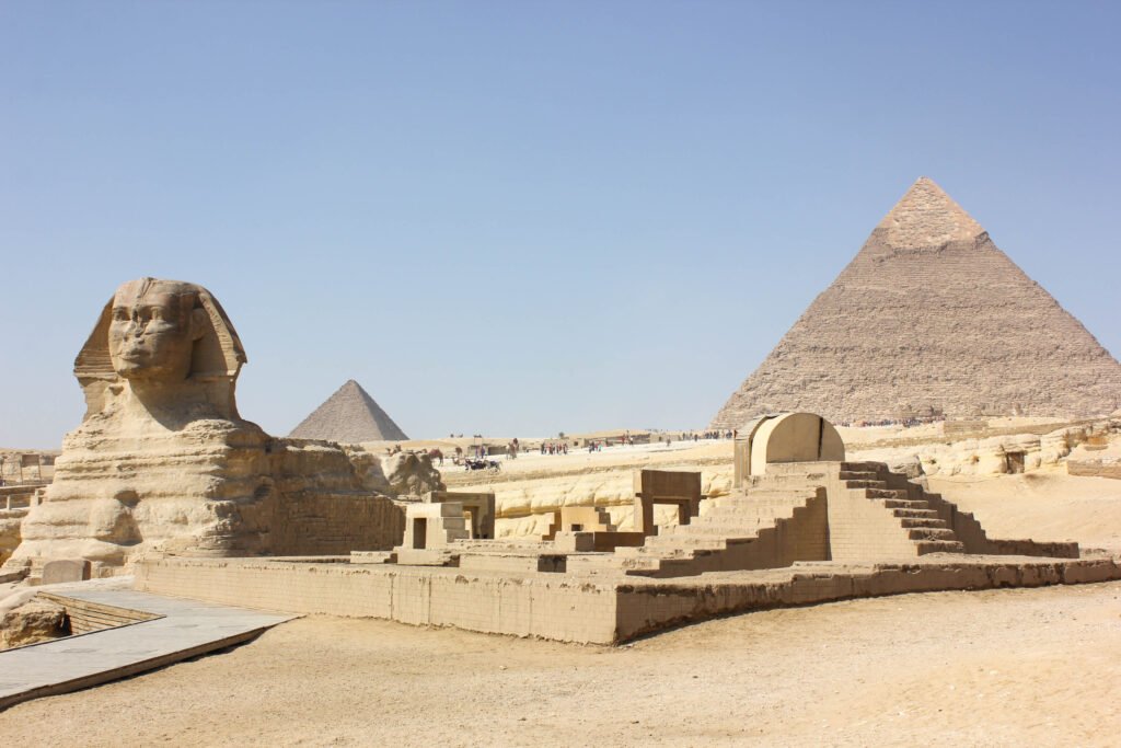 warm desert breeze as it carries whispers of pharaohs and gods across golden sands