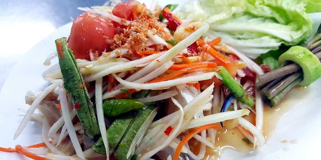 Papaya salad (som tam) in Bangkok's bustling markets