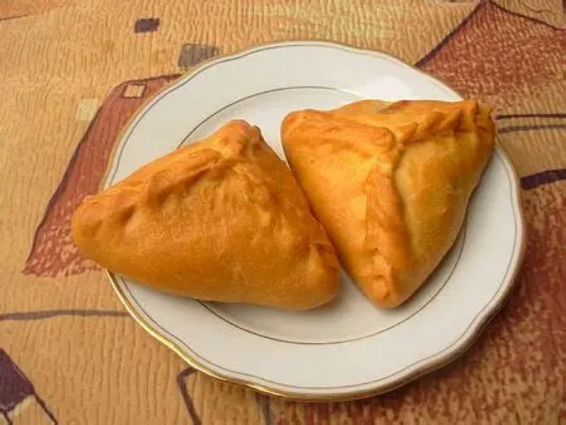 Echpochmak, a triangular Tatar pastry filled with meat and potatoes.