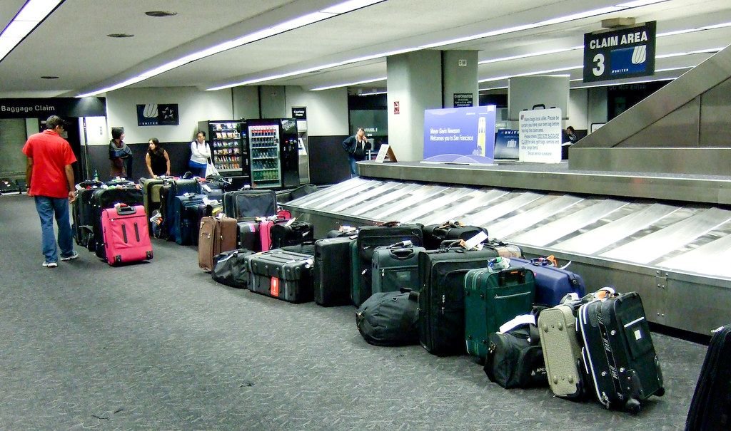  watching the luggage carousel spin endlessly without my backpack appearing